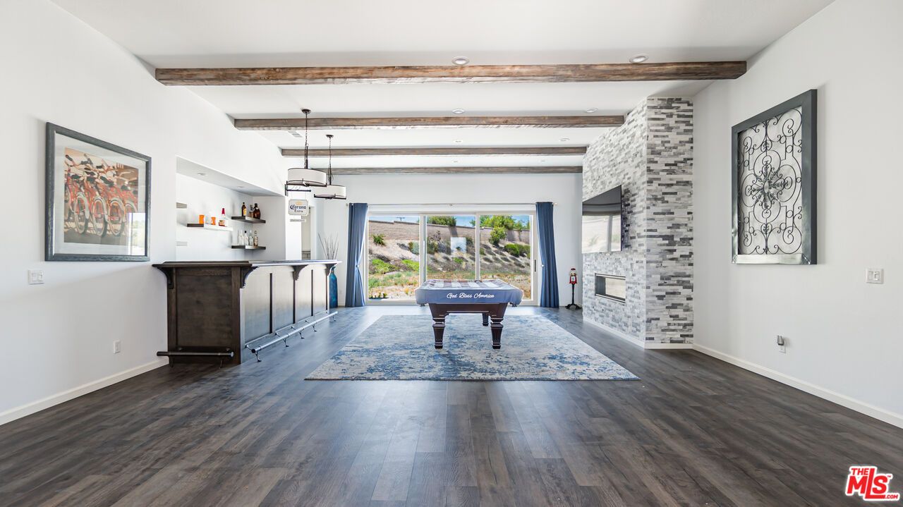 Billiard Table, Fireplace, Game Room, Interior, Pendant Lights, Recessed Lighting, Stone Walls, Wooden Beams, Wood Texture Flooring