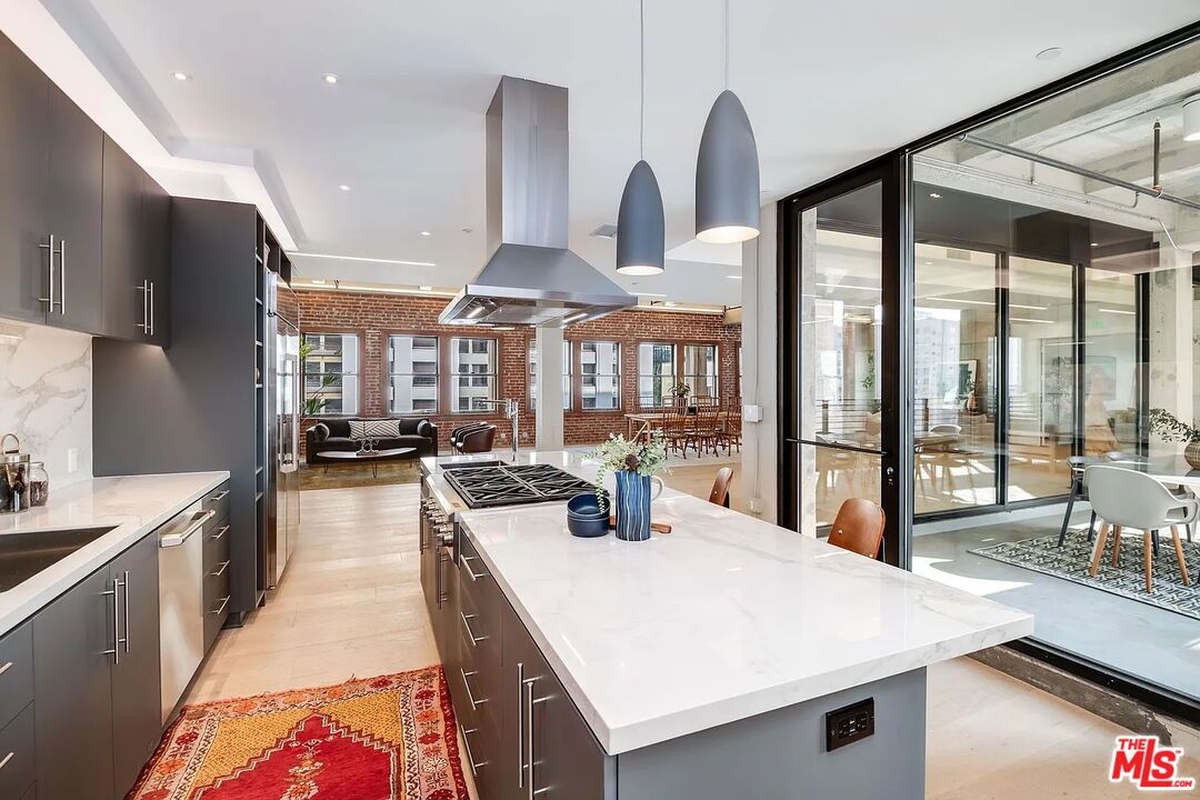 Dining room, Interior, Kitchen, Pendant Lights, Recessed Lighting, Stainless Steel Appliances, Stone Walls, Wood Texture Flooring