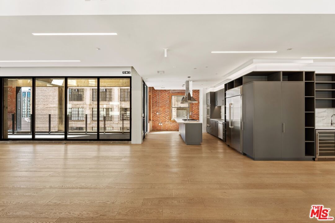 Interior, Kitchen, Recessed Lighting, Stainless Steel Appliances, Stone Walls, Wood Texture Flooring