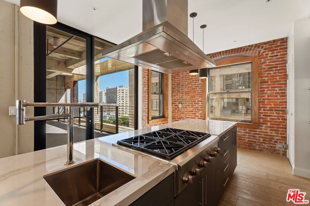Interior, Kitchen, Pendant Lights, Recessed Lighting, Stainless Steel Appliances, Stone Walls, Wood Texture Flooring