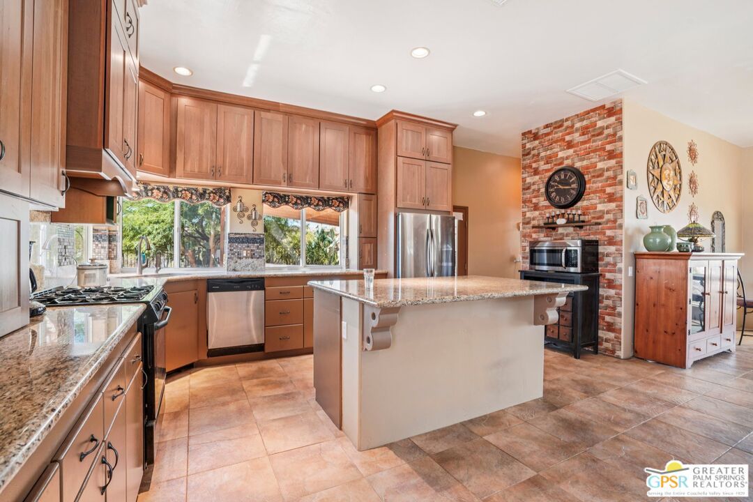 Fireplace, Interior, Kitchen, Recessed Lighting, Stainless Steel Appliances, Stone Walls