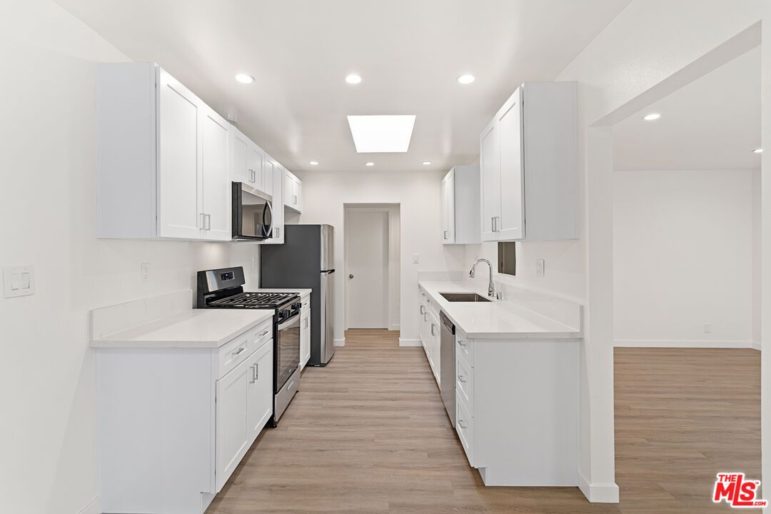 Interior, Kitchen, Recessed Lighting, Stainless Steel Appliances, Wood Texture Flooring