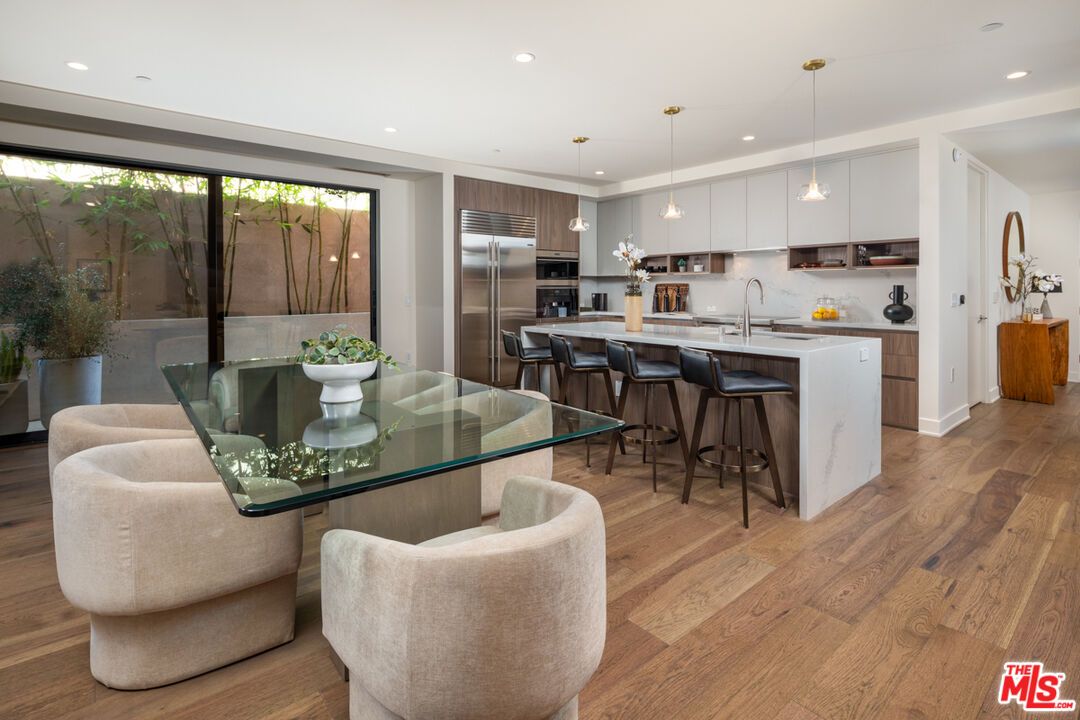 Dining room, Interior, Kitchen, Pendant Lights, Recessed Lighting, Stainless Steel Appliances, Wood Texture Flooring