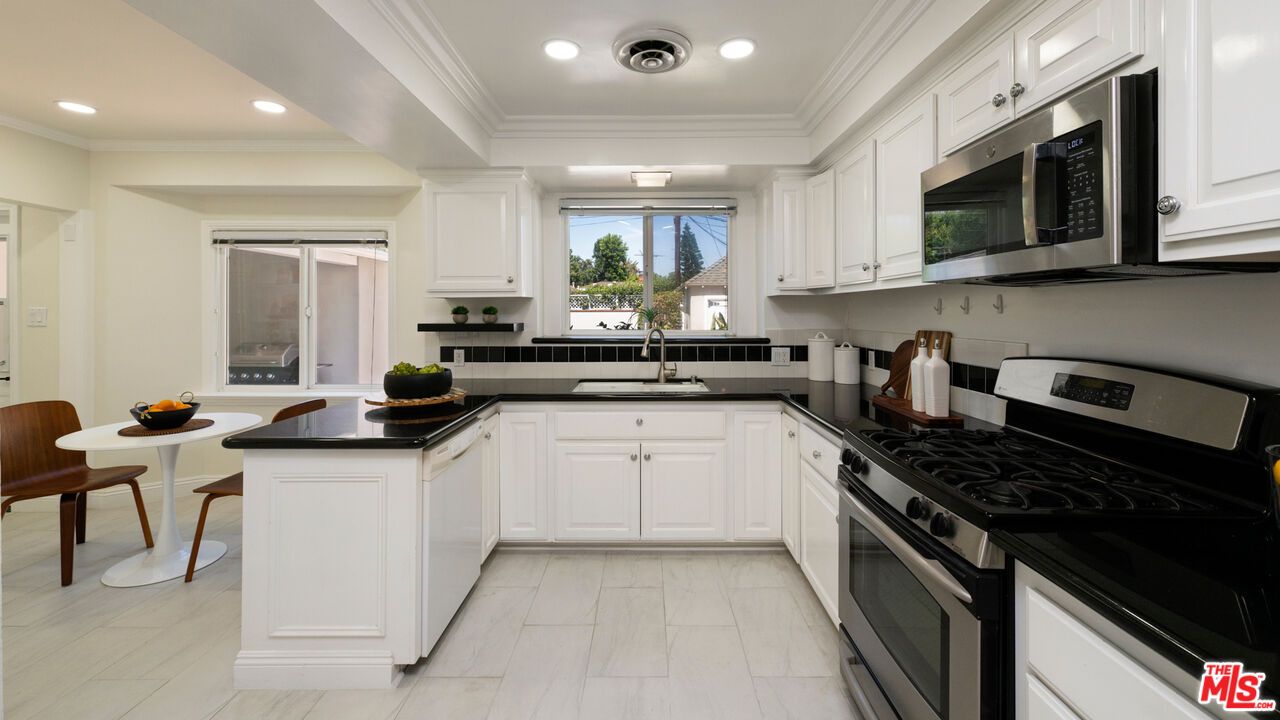 Dining room, Interior, Kitchen, Recessed Lighting, Stainless Steel Appliances, Wood Texture Flooring