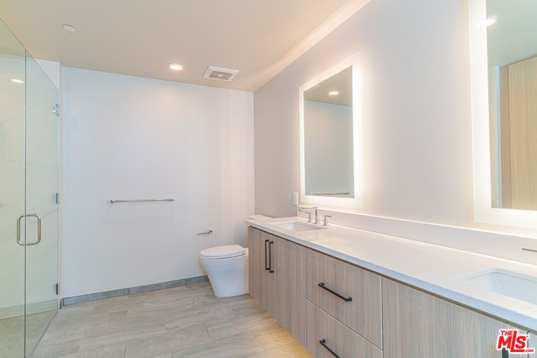 Bathroom, Dual Sink Vanities, Glass Shower, Interior, Recessed Lighting, Wood Texture Flooring