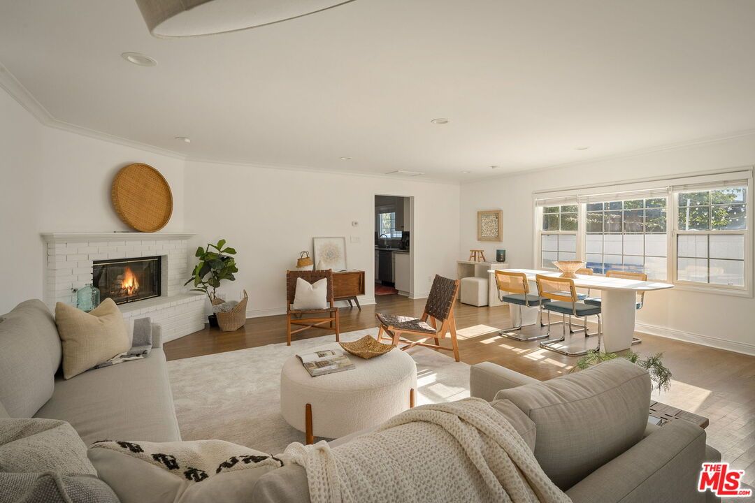 Dining room, Fireplace, Interior, Living room, Recessed Lighting, Wood Texture Flooring