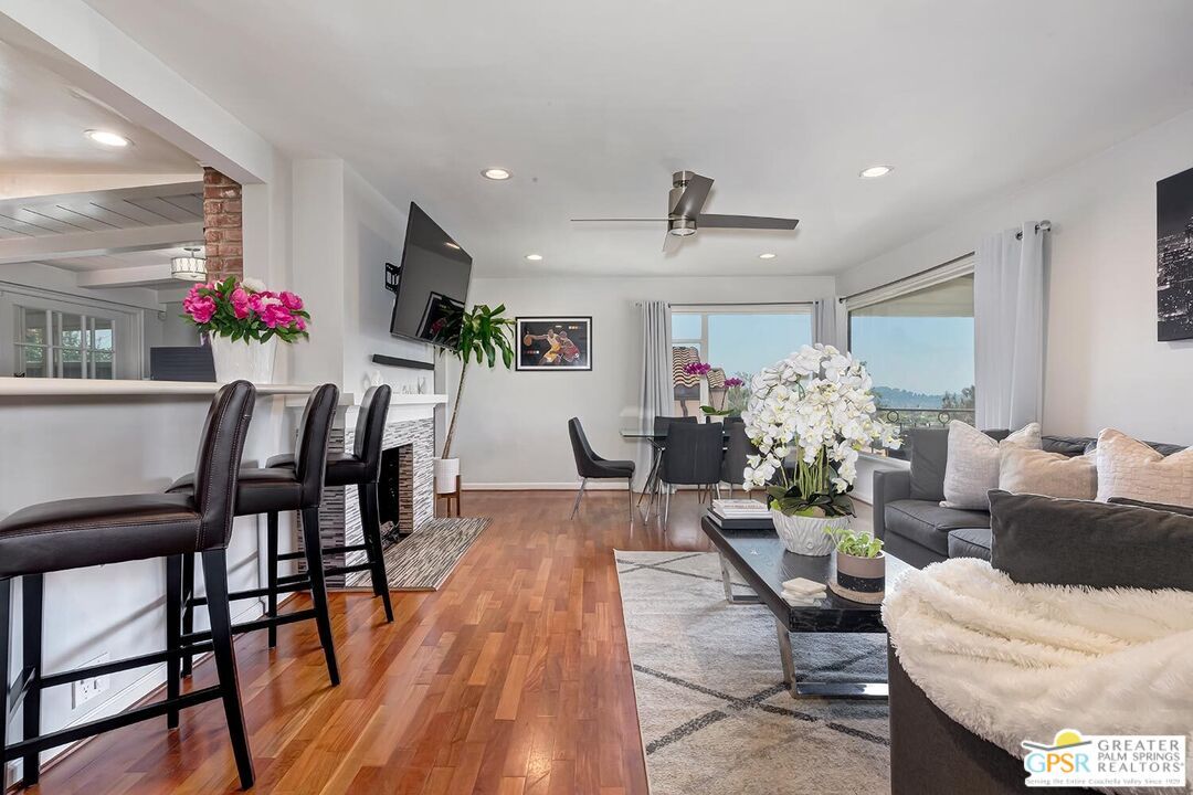 Dining room, Fireplace, Interior, Living room, Recessed Lighting, Wood Texture Flooring