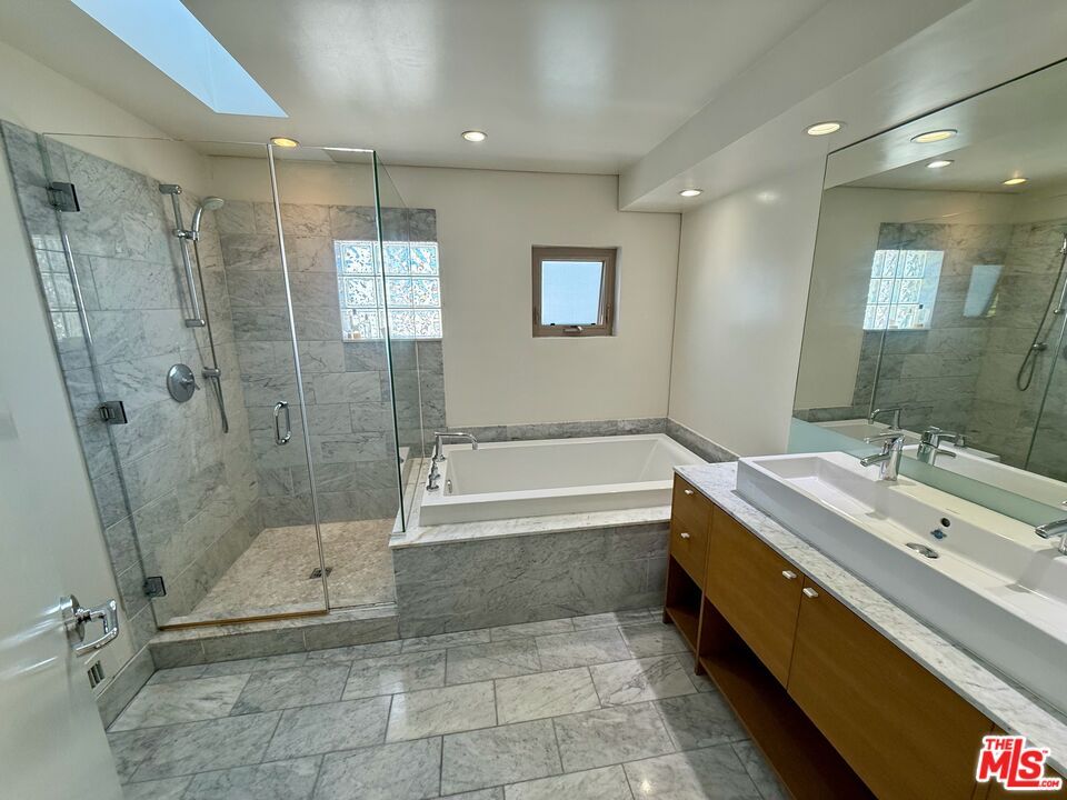 Bathroom, Dual Sink Vanities, Glass Shower, Interior, Marble, Marble Walls, Recessed Lighting
