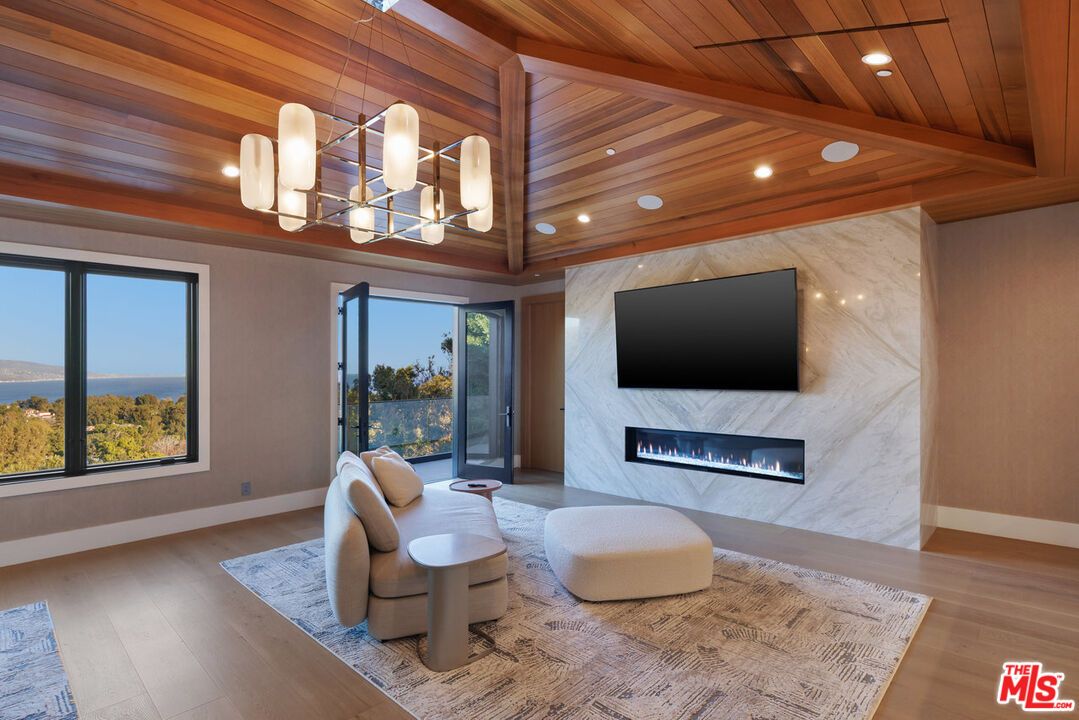 Fireplace, Interior, Living room, Marble Walls, Pendant Lights, Recessed Lighting, Wooden Ceilings, Wood Texture Flooring