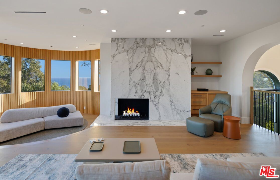 Fireplace, Interior, Living room, Marble Walls, Recessed Lighting, Water, Wood Texture Flooring