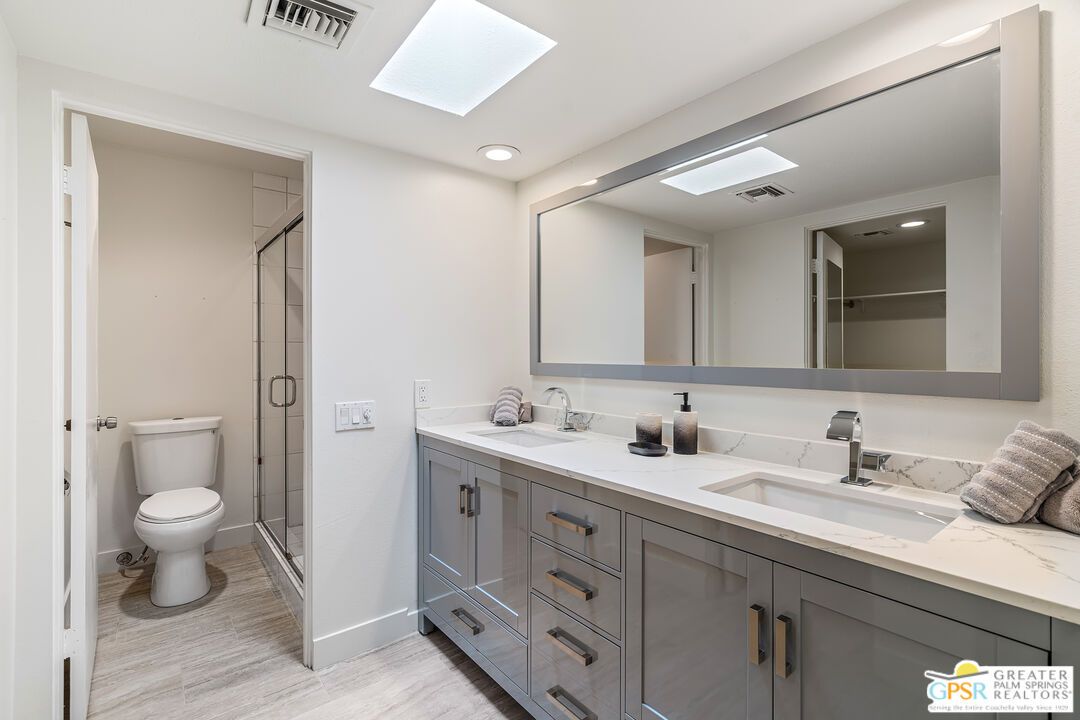 Bathroom, Dual Sink Vanities, Glass Shower, Interior, Recessed Lighting, Wood Texture Flooring