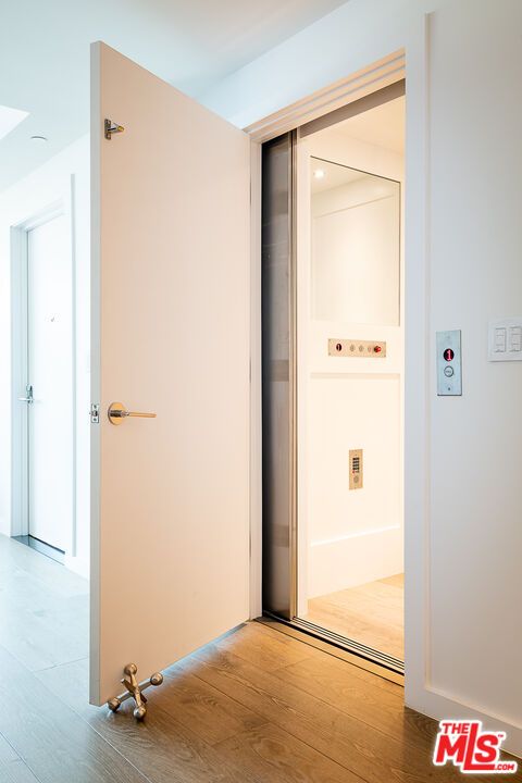 Elevator, Interior, Recessed Lighting, Wood Texture Flooring