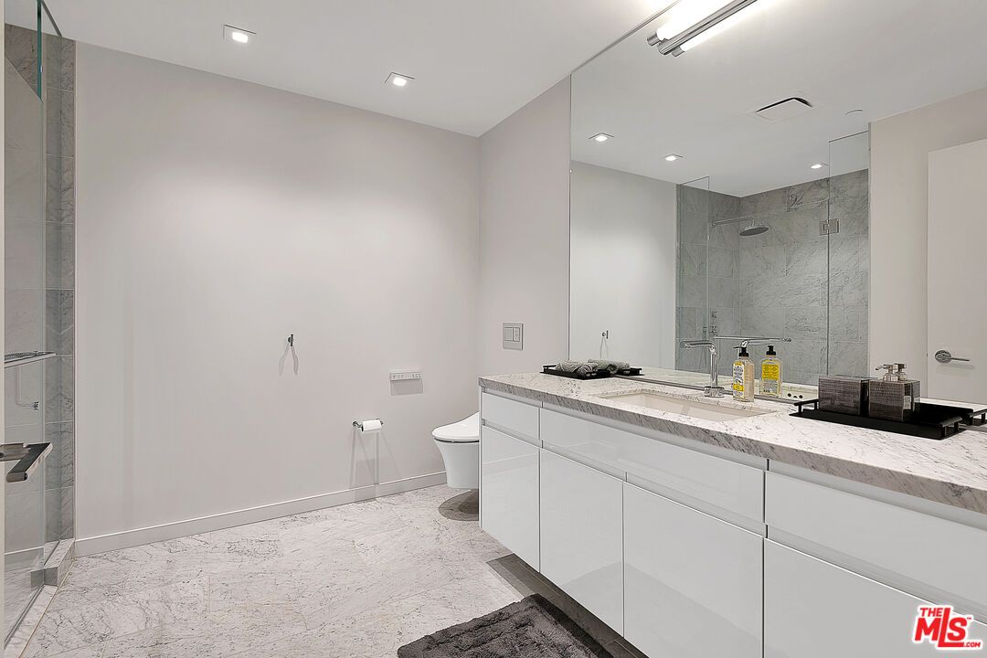 Bathroom, Dual Sink Vanities, Glass Shower, Interior, Marble, Marble Walls, Recessed Lighting