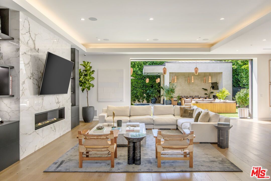 Dining room, Fireplace, Interior, Living room, Marble Walls, Pendant Lights, Recessed Lighting, Wood Texture Flooring