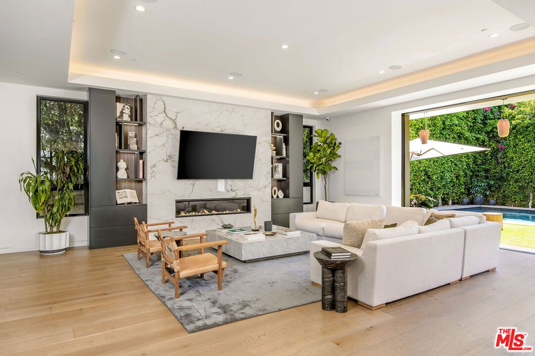 Dining room, Fireplace, Interior, Living room, Marble Walls, Recessed Lighting, Wood Texture Flooring