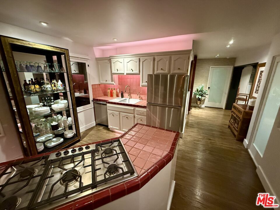 Interior, Kitchen, Recessed Lighting, Tile Countertops, Wood Texture Flooring