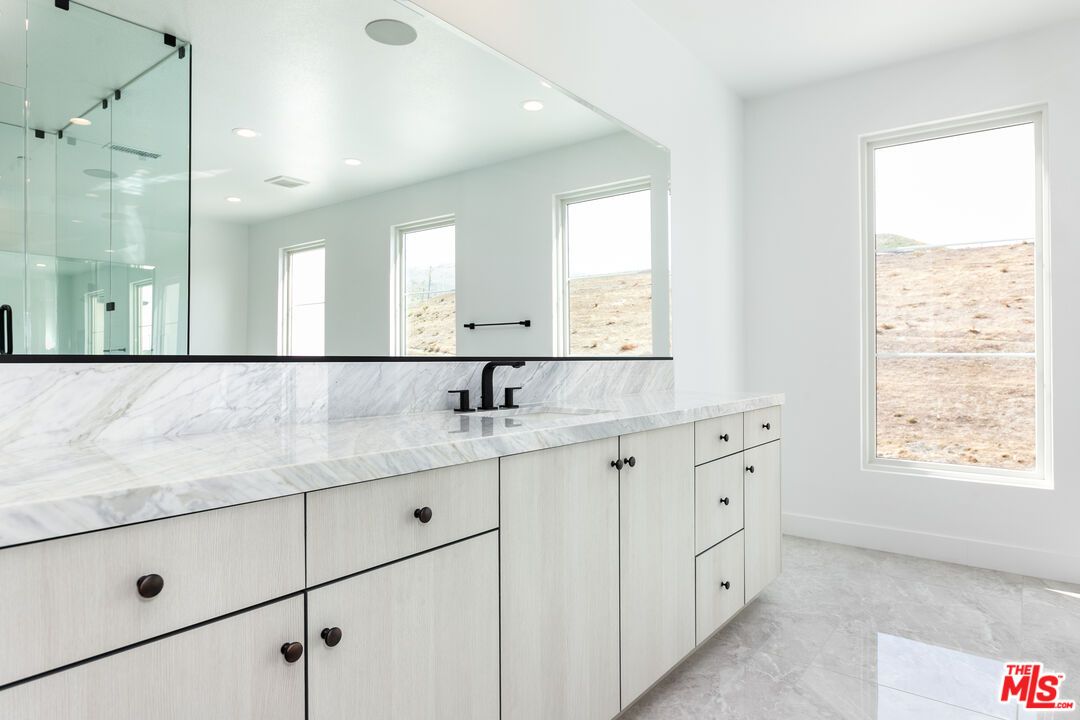 Bathroom, Dual Sink Vanities, Glass Shower, Interior, Marble Walls, Recessed Lighting