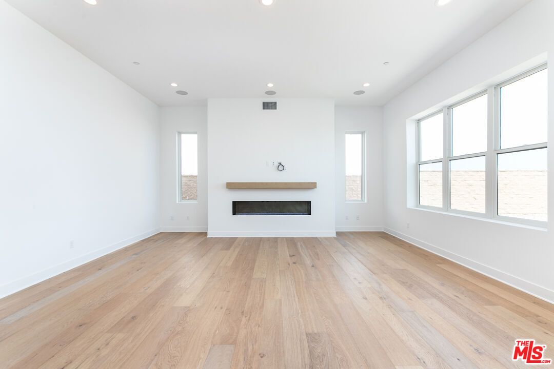 Empty room, Fireplace, Interior, Recessed Lighting, Wood Texture Flooring