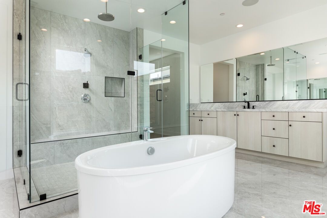 Bathroom, Dual Sink Vanities, Free Standing Baths, Glass Shower, Interior, Marble Walls, Recessed Lighting