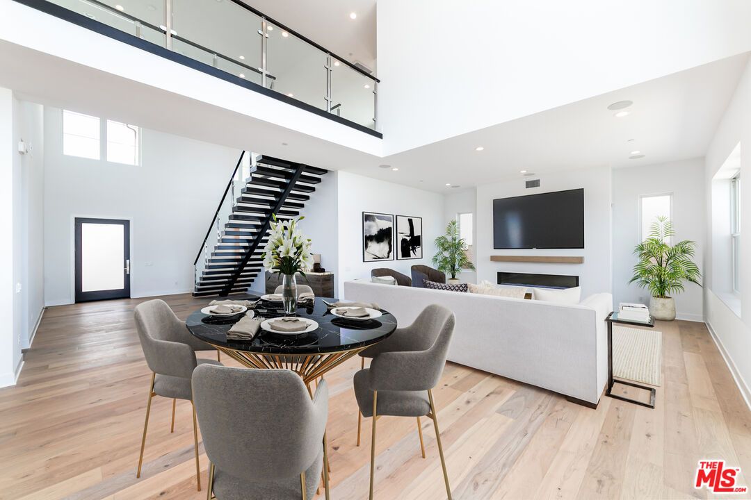 Dining room, Fireplace, Interior, Living room, Recessed Lighting, Wood Texture Flooring