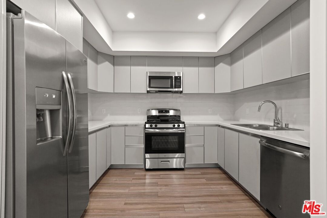 Interior, Kitchen, Recessed Lighting, Stainless Steel Appliances, Wood Texture Flooring