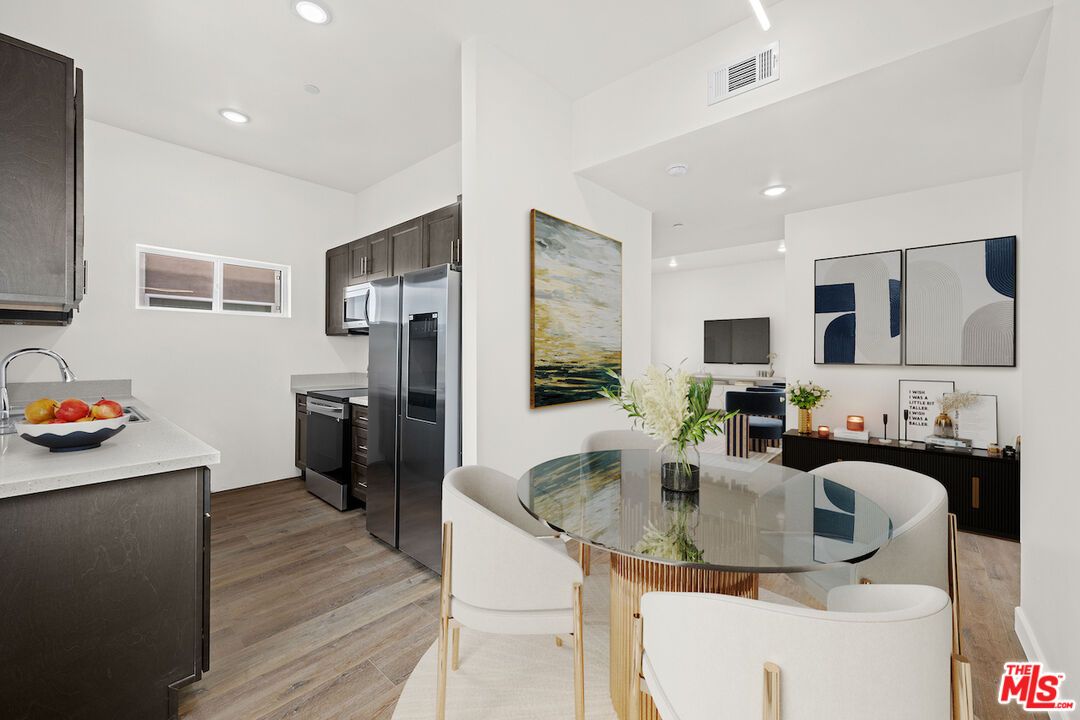 Dining room, Interior, Kitchen, Recessed Lighting, Stainless Steel Appliances, Wood Texture Flooring