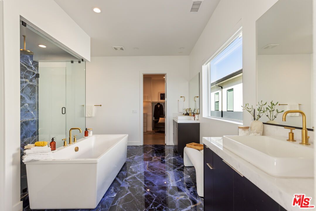 Bathroom, Dual Sink Vanities, Free Standing Baths, Glass Shower, Interior, Marble, Marble Walls, Recessed Lighting