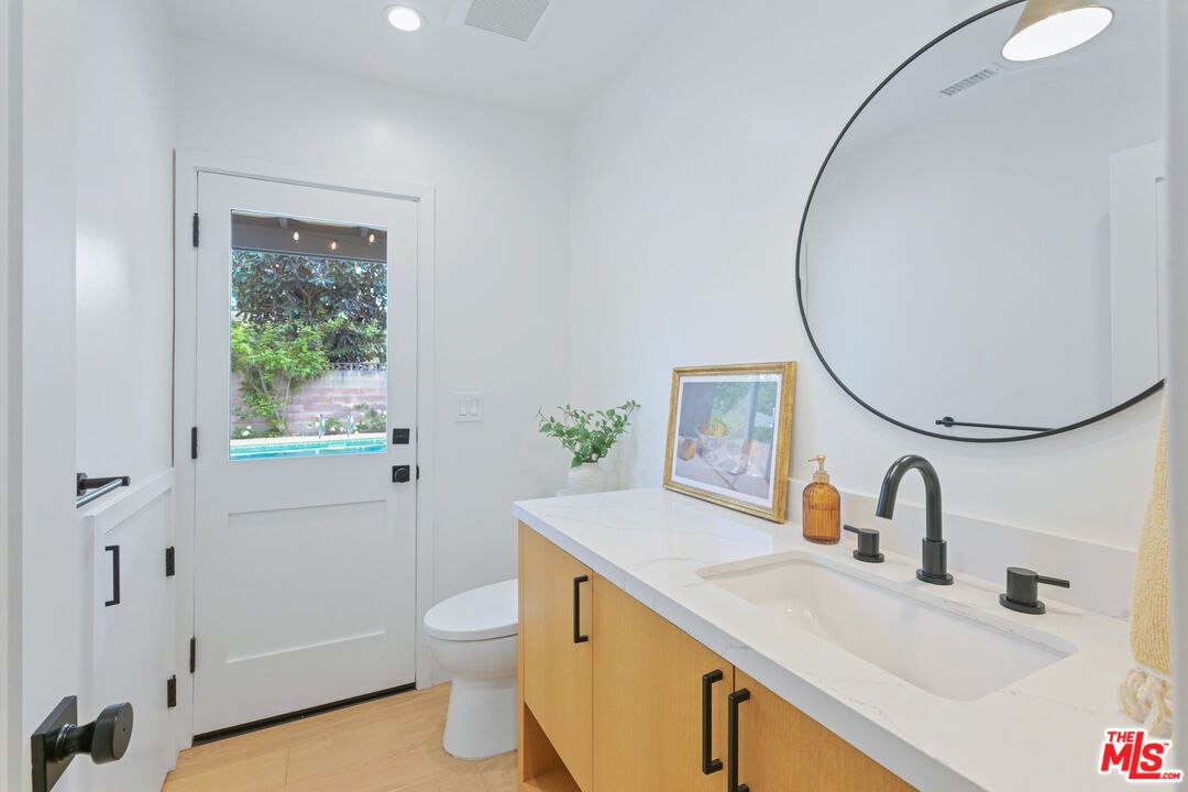 Bathroom, Dual Sink Vanities, Interior, Recessed Lighting, Wood Texture Flooring