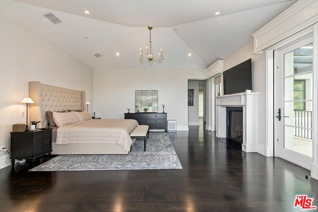 Bedroom, Chandelier, Fireplace, Interior, Recessed Lighting, Wood Texture Flooring