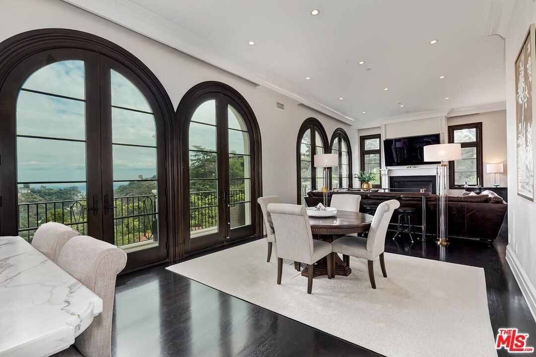 Dining room, Fireplace, Interior, Living room, Recessed Lighting, Water, Wood Texture Flooring