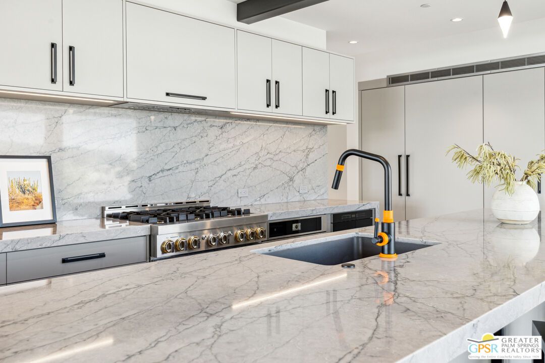 Interior, Kitchen, Marble Walls, Recessed Lighting, Stainless Steel Appliances