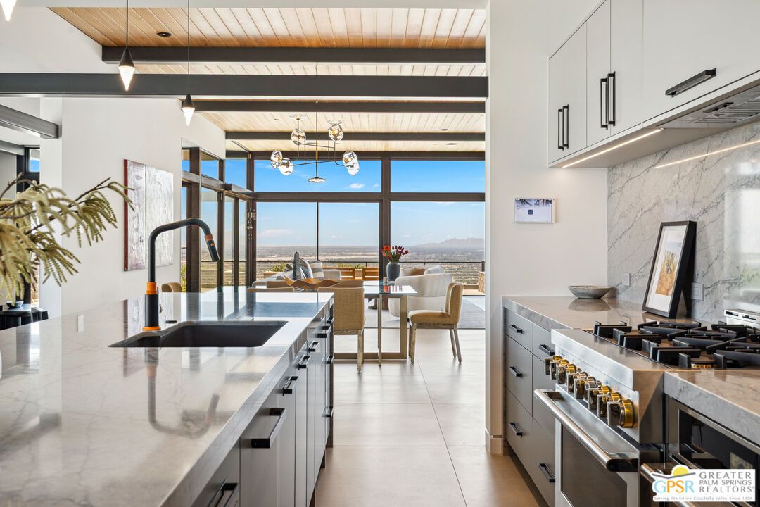 Dining room, Interior, Kitchen, Marble Walls, Pendant Lights, Stainless Steel Appliances, Water, Wooden Ceilings
