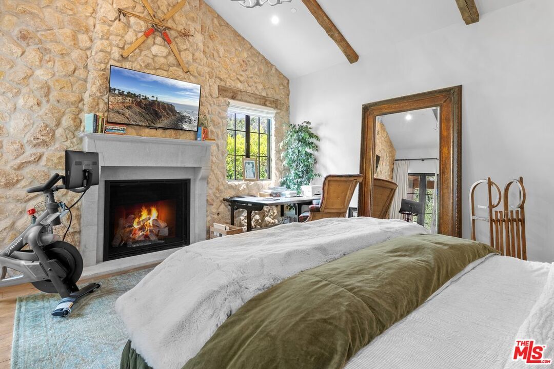 Bedroom, Fireplace, Fitness Equipment, Interior, Recessed Lighting, Stone Walls, Wooden Beams