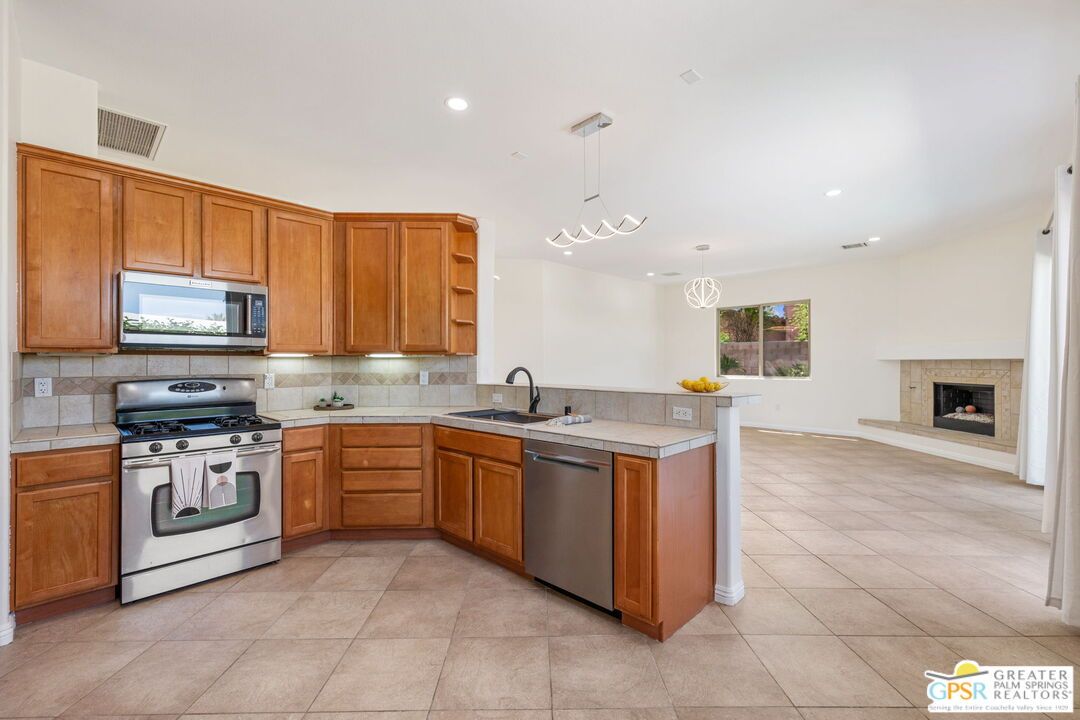 Fireplace, Interior, Kitchen, Pendant Lights, Recessed Lighting, Stainless Steel Appliances