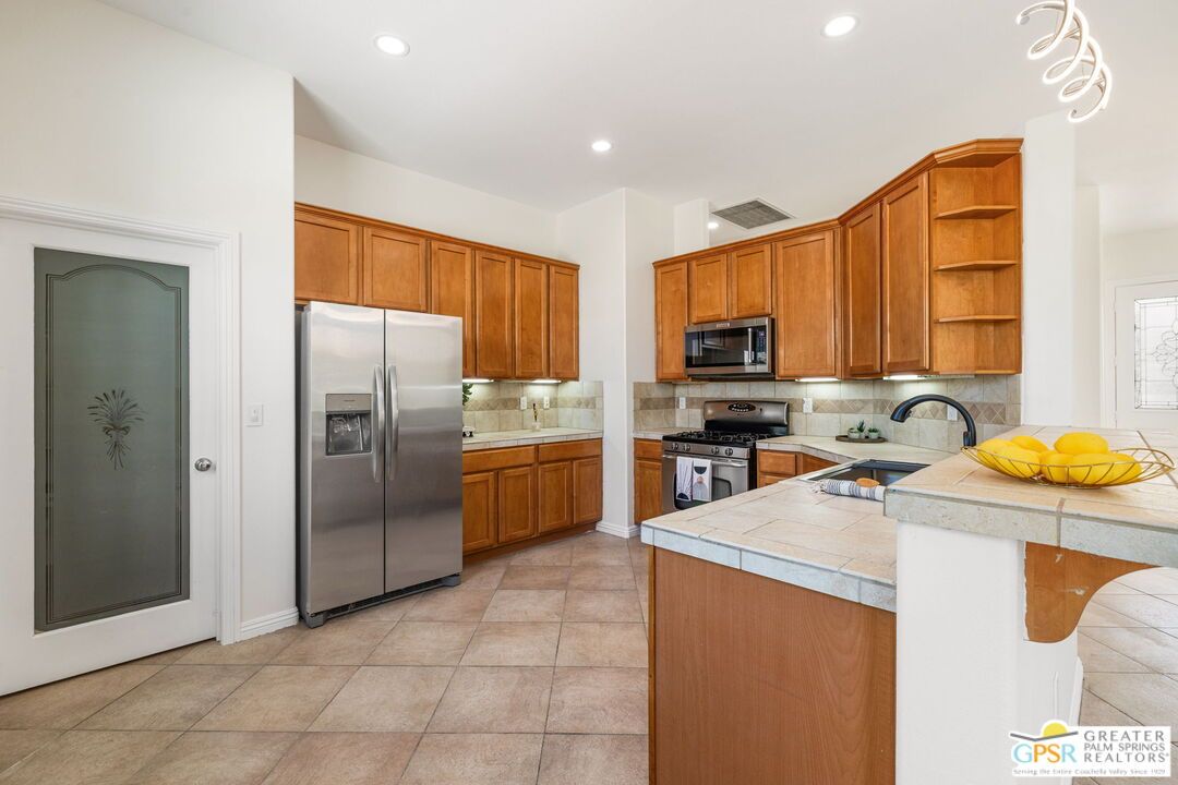 Interior, Kitchen, Recessed Lighting, Stainless Steel Appliances, Tile Countertops