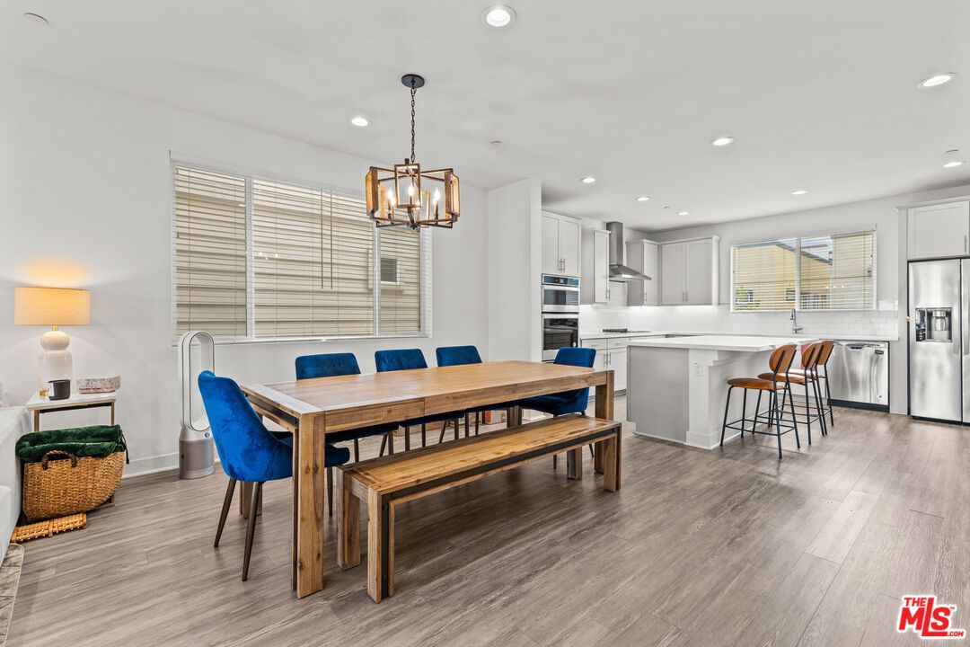 Dining room, Interior, Kitchen, Pendant Lights, Recessed Lighting, Stainless Steel Appliances, Wood Texture Flooring