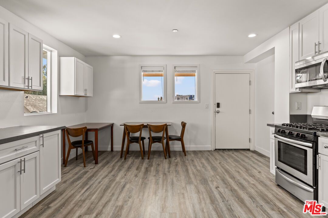 Dining room, Interior, Kitchen, Recessed Lighting, Stainless Steel Appliances, Wood Texture Flooring