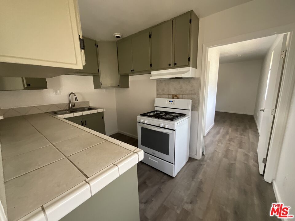 Interior, Kitchen, Tile Countertops, Wood Texture Flooring