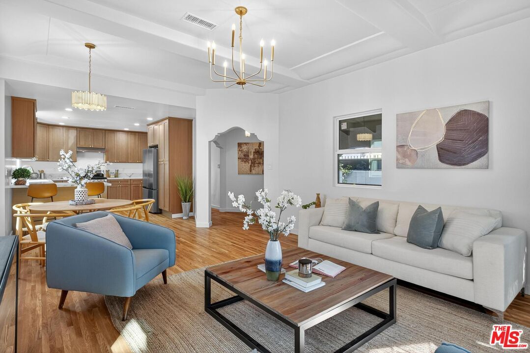 Chandelier, Dining room, Interior, Kitchen, Living room, Pendant Lights, Recessed Lighting, Stainless Steel Appliances, Wood Texture Flooring