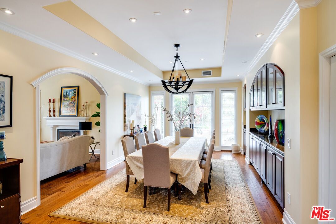 Chandelier, Dining room, Fireplace, Interior, Living room, Pendant Lights, Recessed Lighting, Wood Texture Flooring