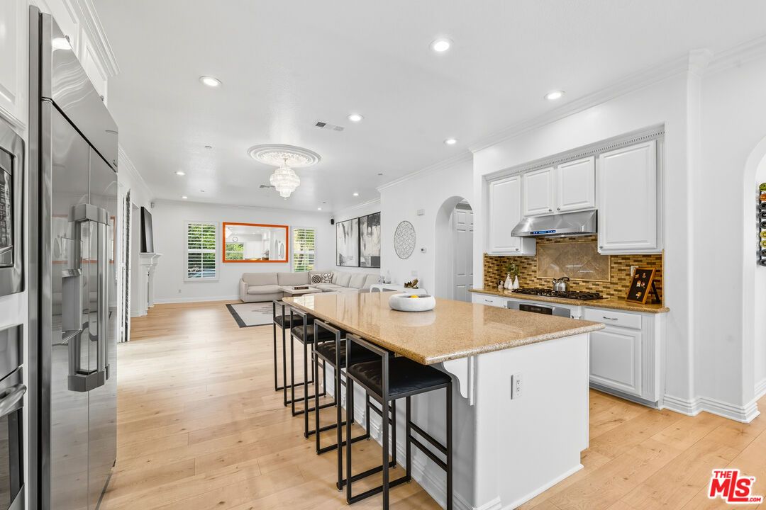 Chandelier, Interior, Kitchen, Living room, Recessed Lighting, Stainless Steel Appliances, Wood Texture Flooring