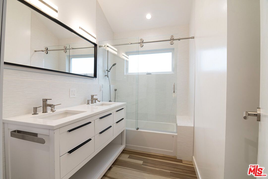 Bathroom, Dual Sink Vanities, Glass Shower, Interior, Recessed Lighting, Wood Texture Flooring