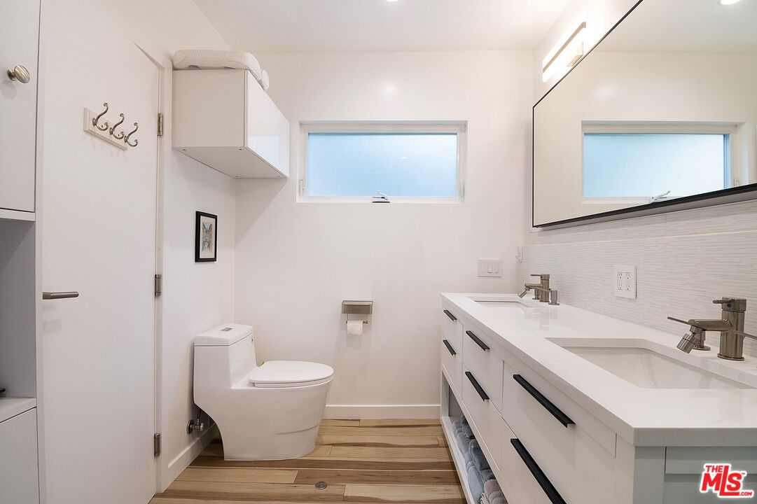 Bathroom, Dual Sink Vanities, Interior, Recessed Lighting, Wood Texture Flooring