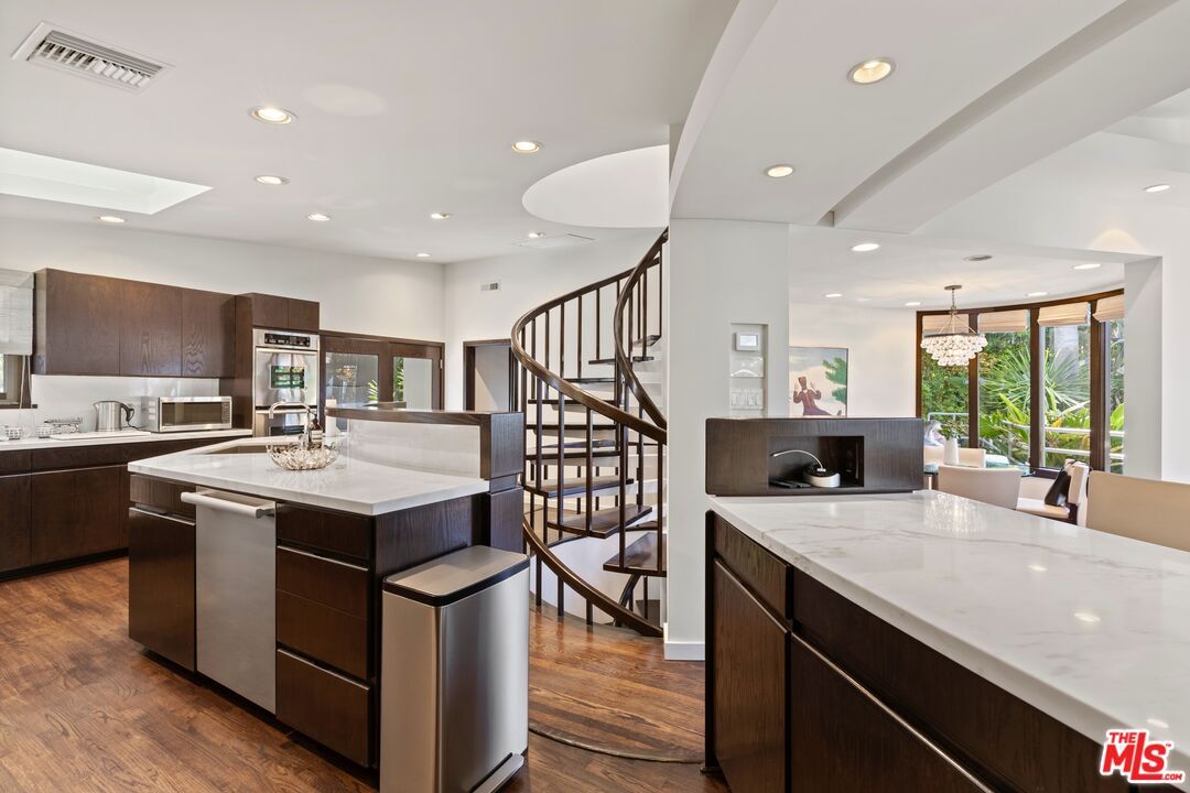 Chandelier, Dining room, Interior, Kitchen, Pendant Lights, Recessed Lighting, Stainless Steel Appliances, Wood Texture Flooring