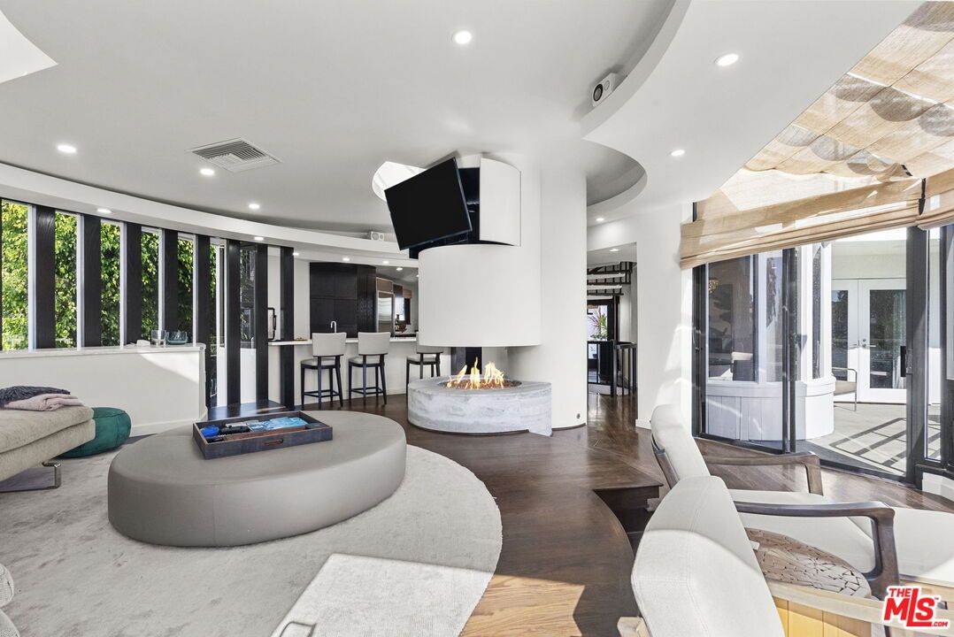 Dining room, Fireplace, Interior, Living room, Recessed Lighting, Wood Texture Flooring