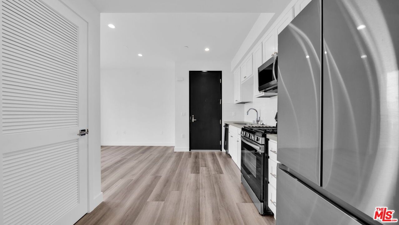 Interior, Kitchen, Recessed Lighting, Stainless Steel Appliances, Wood Texture Flooring