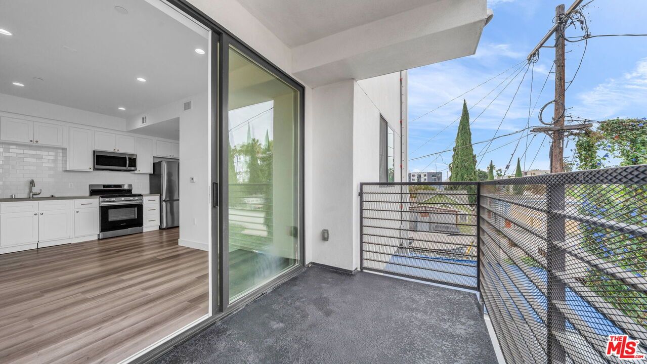 Exterior, Kitchen, Recessed Lighting, Stainless Steel Appliances, Wood Texture Flooring