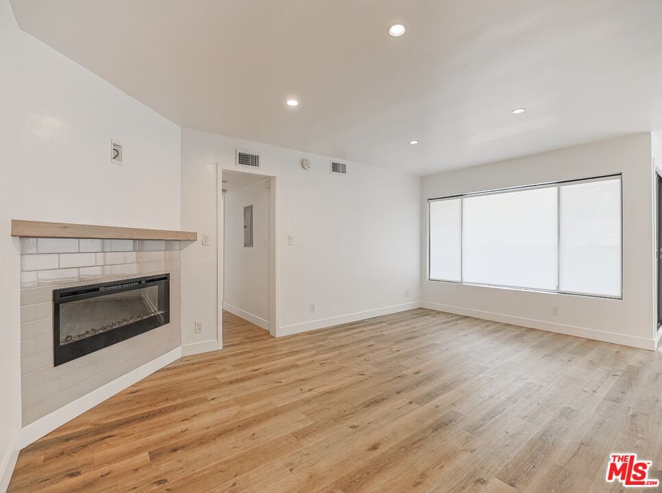 Empty room, Fireplace, Interior, Recessed Lighting, Wood Texture Flooring