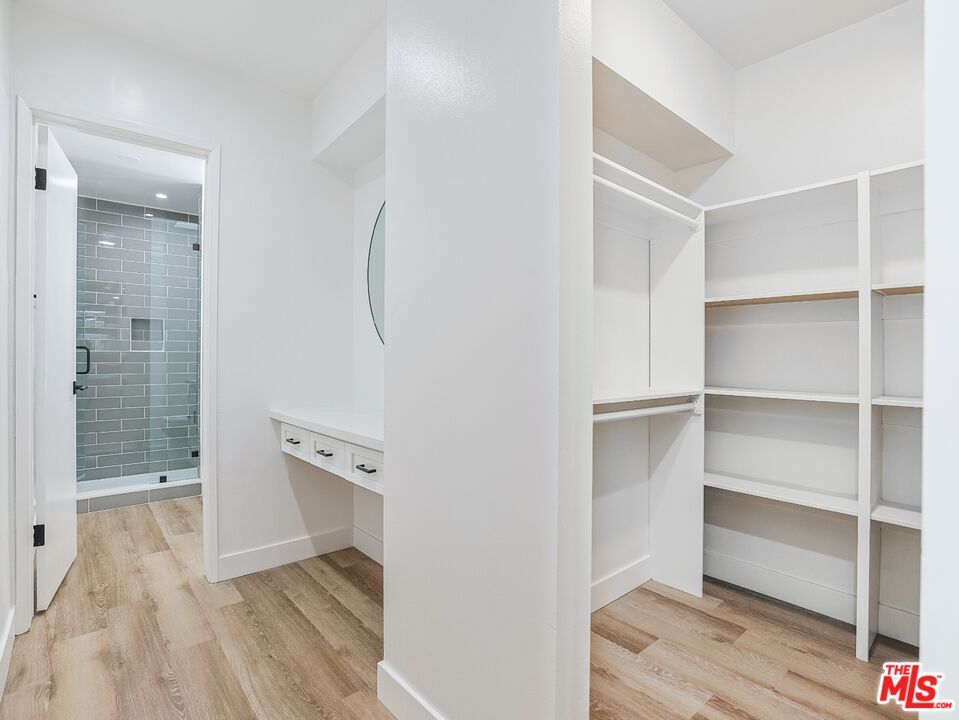 Bathroom, Glass Shower, Interior, Recessed Lighting, Walk-in Closets, Wood Texture Flooring