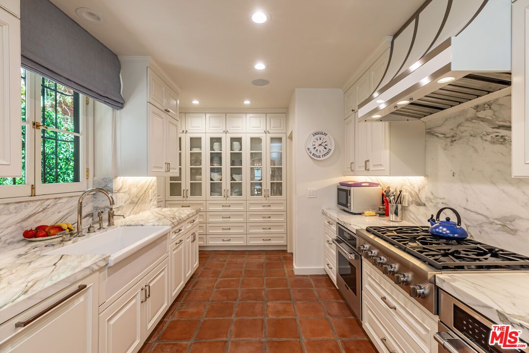 Interior, Kitchen, Marble Walls, Recessed Lighting, Stainless Steel Appliances